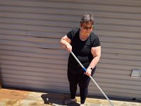 06 Staining the deck behind the house - May 31, 2026